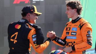 Formula One F1 - Dutch Grand Prix - Circuit Zandvoort, Zandvoort, Netherlands - August 30, 2025
McLaren's Oscar Piastri celebrates after qualifying in pole position with second placed McLaren's Lando Norris REUTERS/Jakub Porzycki